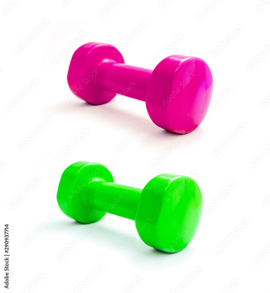 A pair of dumbbells green and glamours pink, isolated on white background. Fitness equipment, healthy lifestyle concept. A pair of dumbbells green and glamours pink, isolated on white background. Fitness equipment, healthy lifestyle concept.