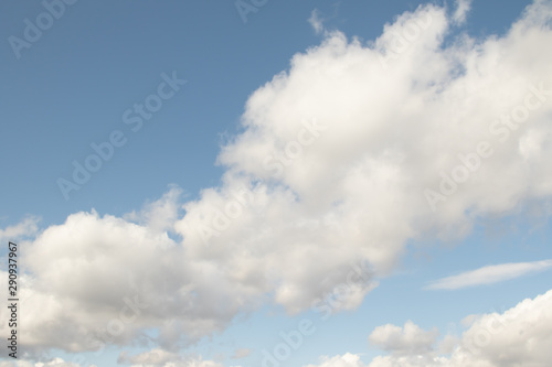 Blue sky with white clouds background.