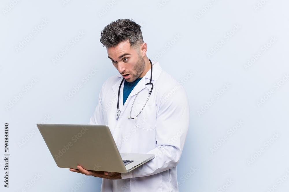 Caucasian doctor man with a laptop Caucasian doctor man with a laptop
