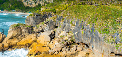 View of pancake rocks in Punakaiki, South island, New Zealand. photo