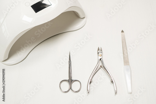 Closeup top view of equipment for making modern gel polish manicure. Horizontal color photography.