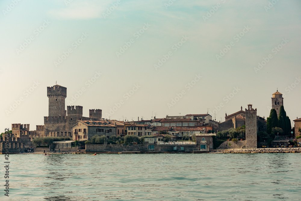 Medieval castle Scaliger on Lake Garda in autumn sunrise, Sirmione, Italy