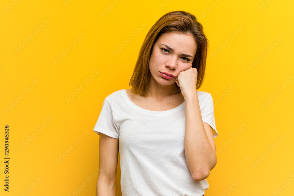 Young natural caucasian woman who feels sad and pensive, looking at copy space. Young natural caucasian woman who feels sad and pensive, looking at copy space.