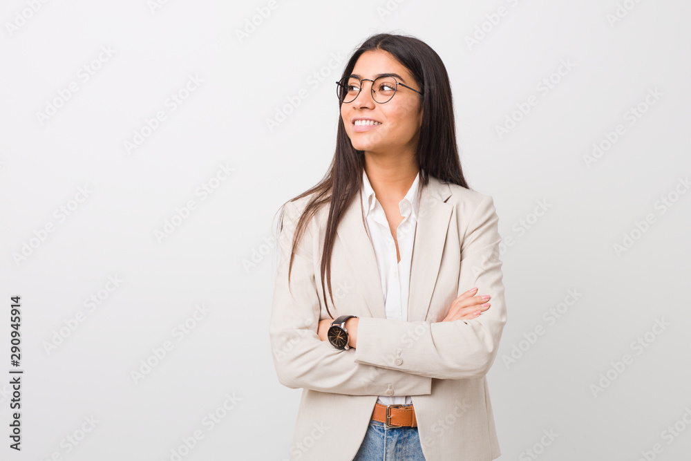 Young business arab woman isolated against a white background smiling confident with crossed arms. Young business arab woman isolated against a white background smiling confident with crossed arms.