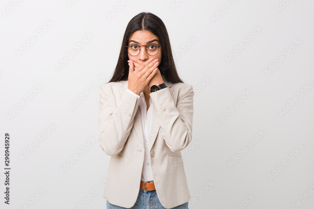 Young business arab woman isolated against a white background shocked covering mouth with hands. Young business arab woman isolated against a white background shocked covering mouth with hands.