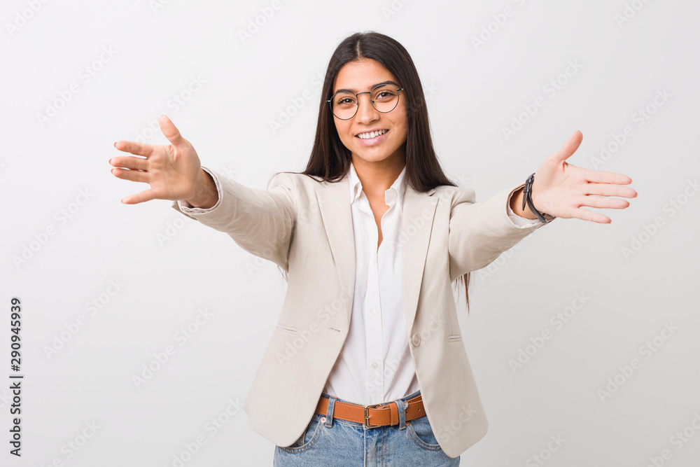 Young business arab woman isolated against a white background feels confident giving a hug to the camera. Young business arab woman isolated against a white background feels confident giving a hug to the camera.