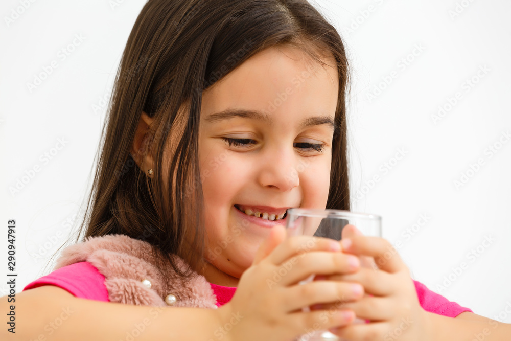 School girl portrait with water glass isolated School girl portrait with water glass isolated