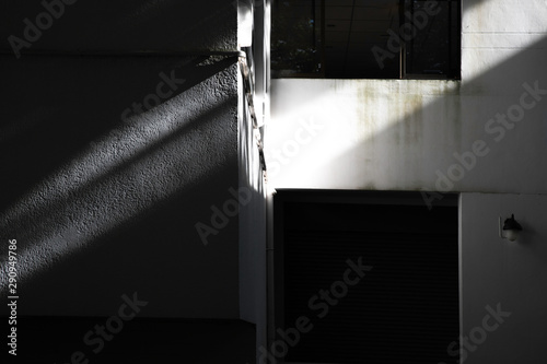 sunlight and Black shadows on the concrete building, abstract shadow, background for ideas