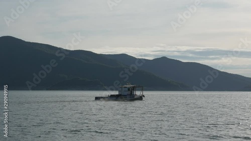Tak, Thailand - 03 09 2019 : Boat Ride  At Bhumibol Dam Tak Province In Thailand. View of boat sail along river in dam on a sunny day and  beautiful mountain landscape .