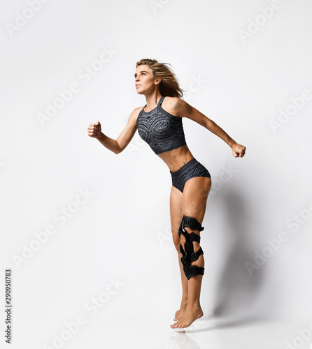 Fototapeta Naklejka Na Ścianę i Meble -  Woman with knee brace. Isolated.