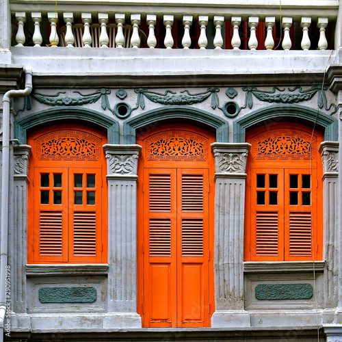 Photography Peranakan shop house with Orange shutters and doors.