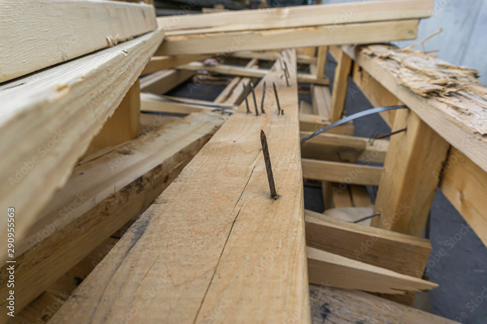 Nails sticking out of pieces of Waste Wood