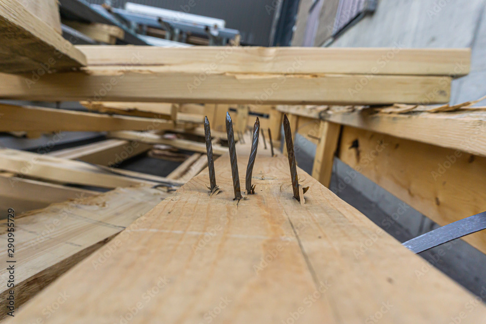 Nails sticking out of pieces of Waste Wood Nails sticking out of pieces of Waste Wood
