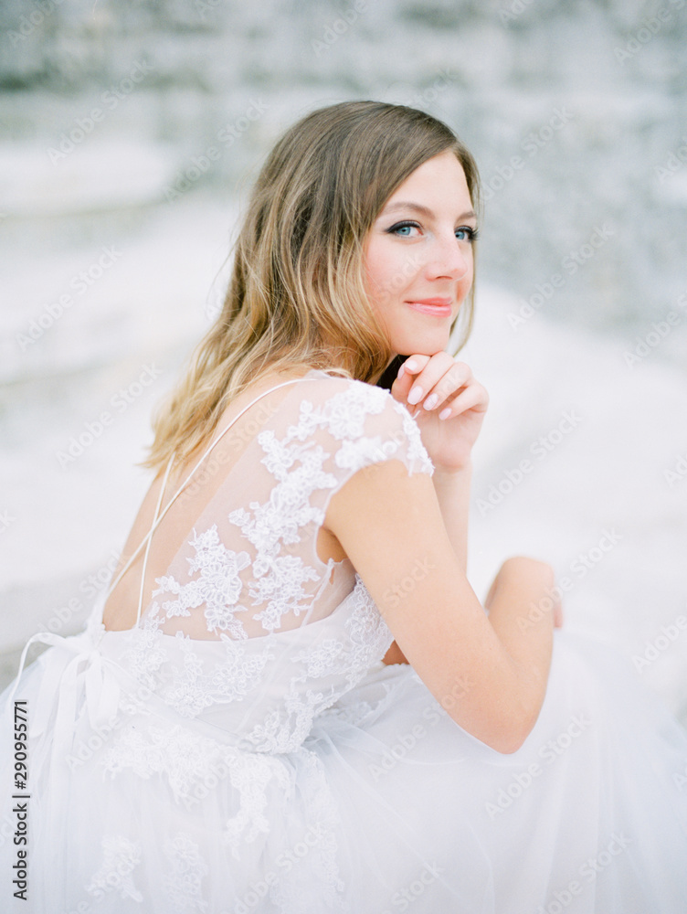 Stylish and beautiful bride portrait near the old Church. Film analog photography Stylish and beautiful bride portrait near the old Church. Film analog photography