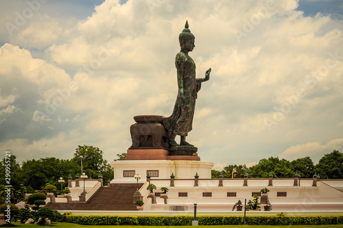 statue of buddha on background of blue sky