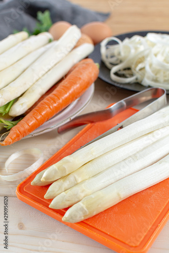 New harvest of white asparagus, high quality peeled and washed raw asparagus in spring season, ready to cook