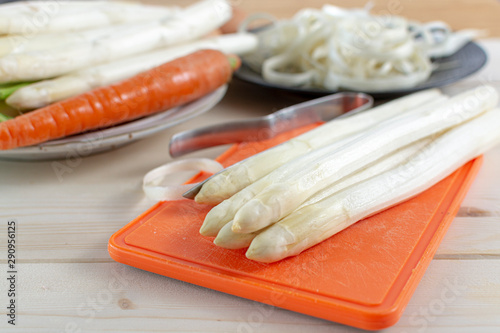 New harvest of white asparagus, high quality peeled and washed raw asparagus in spring season, ready to cook photo