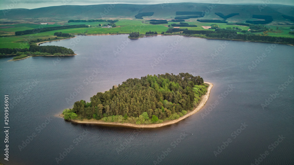 A green oval island in a blue loch