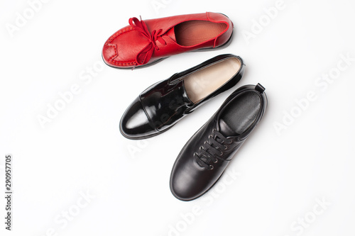 Set of autumn black shoes and one red on white background