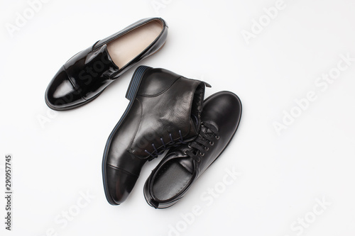 Different black leather women autumn shoes on white background