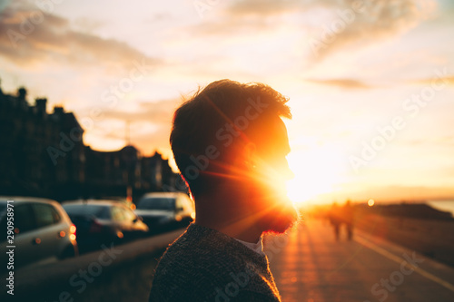 Man looking into the sun