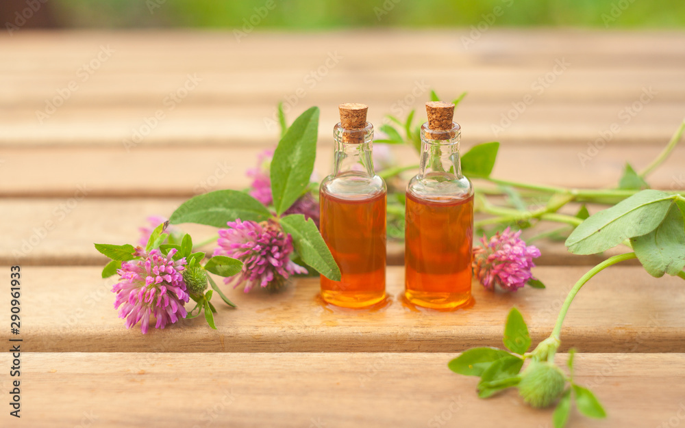 Essence of flowers on table in beautiful glass jar Essence of flowers on table in beautiful glass jar