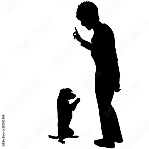 Silhouette of woman and Dog sitting on its hind legs on a white background