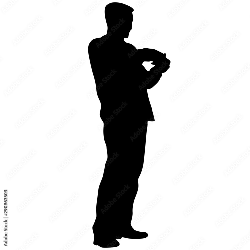A man stands with his hands in front, silhouette on a white background A man stands with his hands in front, silhouette on a white background