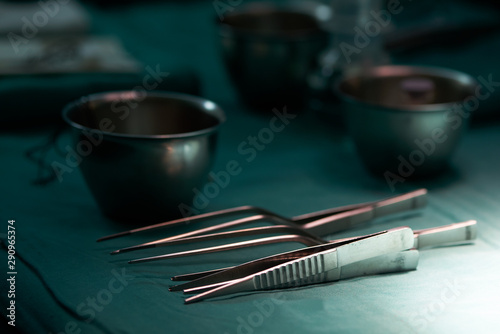 Surgical instrument on green table in operating room