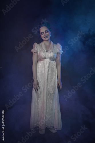 Ghost woman in white victorian dress. Halloween scene
