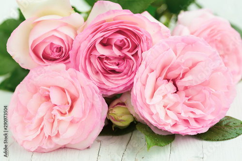 Bunch of pink roses on table