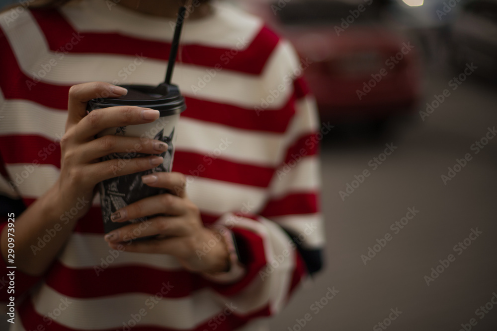 hands of woman with coffee