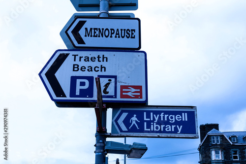 Conceptual hand writing showing Menopause. Concept meaning Period of peranalysisent cessation or end of menstruation cycle Advertisement concept with empty copy space on the road sign photo