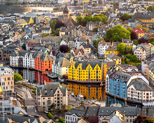 Alesund is a port and tourist city at the entrance to the Geirangerfjord.  Cityscape image of Alesund  at dawn. photo