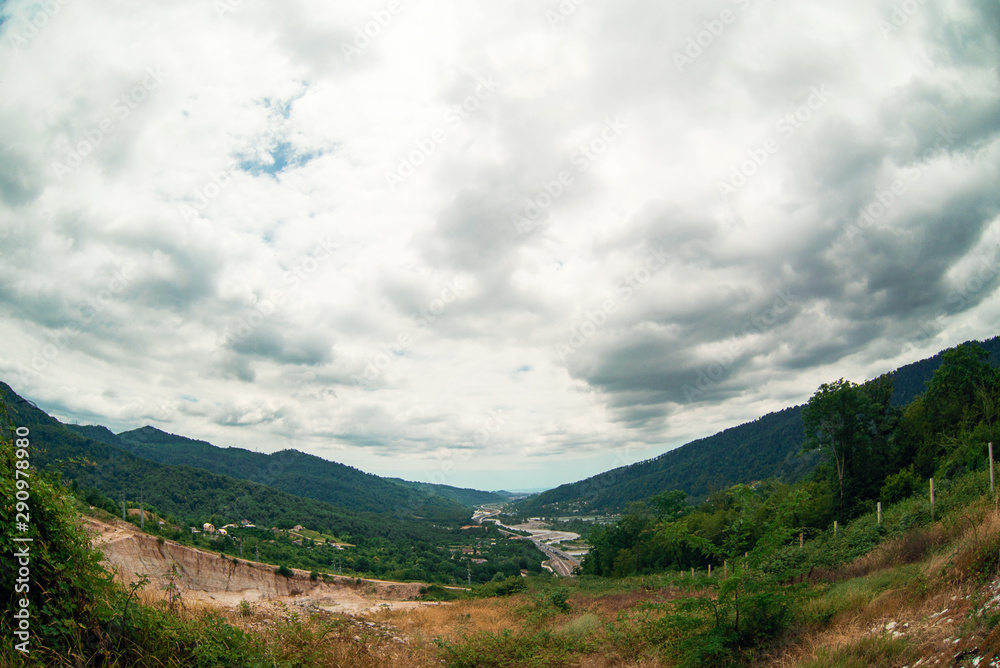 The view of the mountains and the sky in cloudy weather The view of the mountains and the sky in cloudy weather
