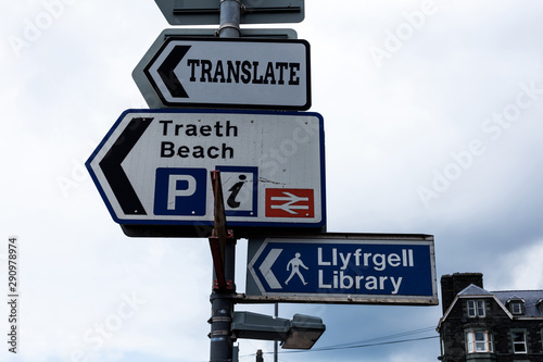 Conceptual hand writing showing Translate. Concept meaning Another word with same equivalent meaning of a target language Advertisement concept with empty copy space on the road sign photo