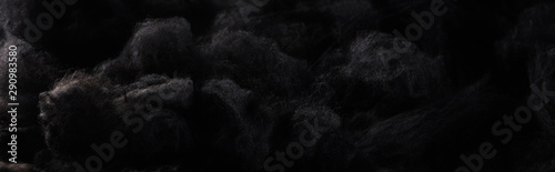Panoramic shot of black cotton wool clouds, dark Halloween background