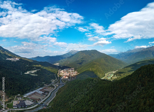 Rosa Khutor railway station in a gorge among the high Caucasus mountains  South of Russia  on a sunny summer morning