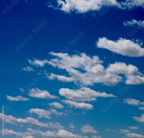The white cloudscape in the bright blue sky