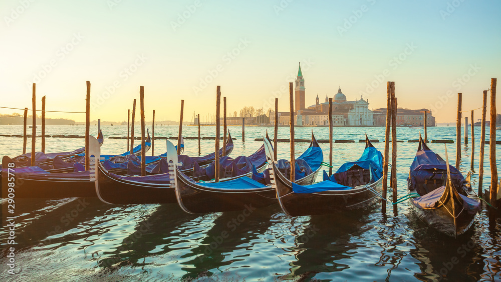 Sunrise at Venice with gondola and island of st george view from the square San marco