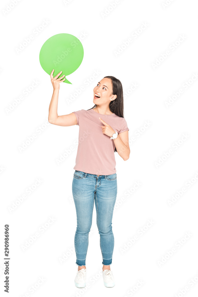 cheerful asian girl pointing with finger at blank thought bubble on white background cheerful asian girl pointing with finger at blank thought bubble on white background