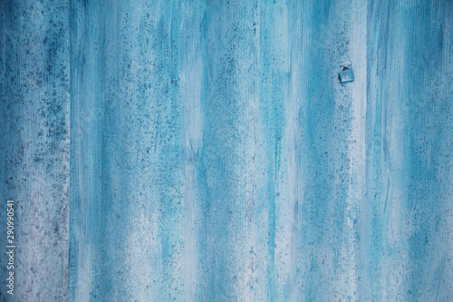 The wall is painted with blue paint as an abstract background