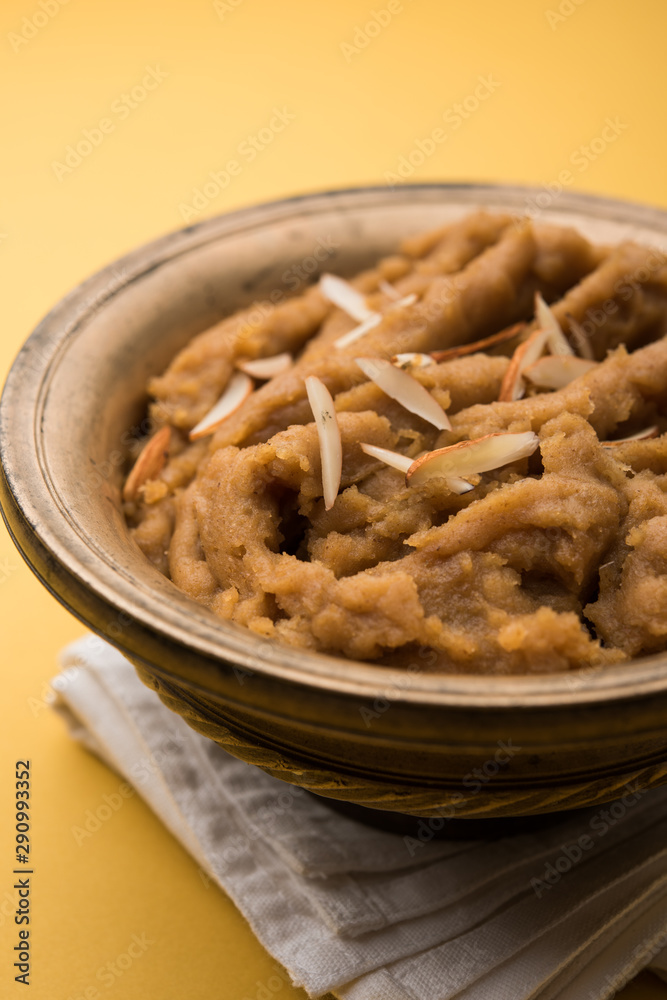Wheat flour Halwa or Shira or porridge / Atte ka Halva, Popular healthy dessert or breakfast menu from India. served in a bowl or plate. selective focus Wheat flour Halwa or Shira or porridge / Atte ka Halva, Popular healthy dessert or breakfast menu from India. served in a bowl or plate. selective focus