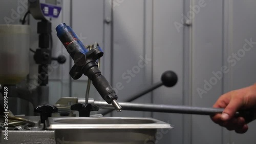 disassembling, checking and adjusting diesel injectors on a stand