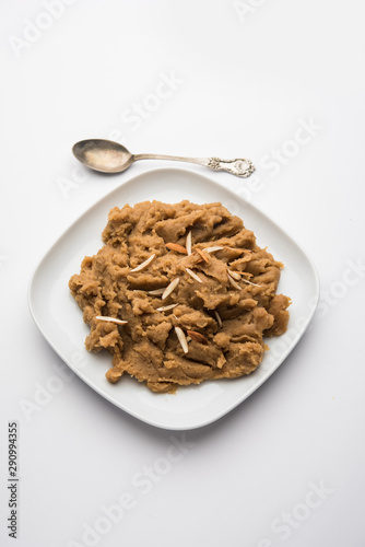 Wheat flour Halwa or Shira or porridge / Atte ka Halva, Popular healthy dessert or breakfast menu from India. served in a bowl or plate. selective focus