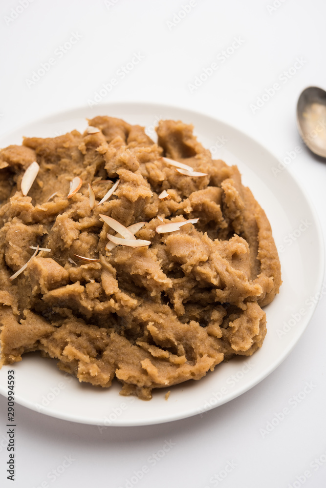 Wheat flour Halwa or Shira or porridge / Atte ka Halva, Popular healthy dessert or breakfast menu from India. served in a bowl or plate. selective focus Wheat flour Halwa or Shira or porridge / Atte ka Halva, Popular healthy dessert or breakfast menu from India. served in a bowl or plate. selective focus