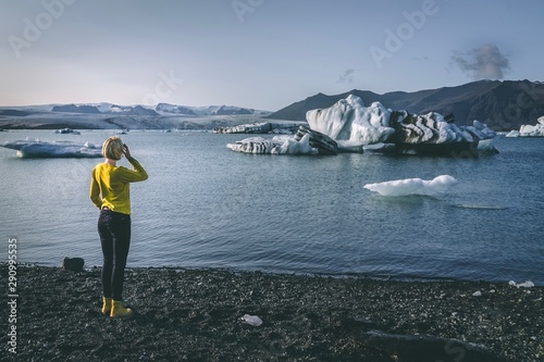 Person watching glaciers in Iceland.