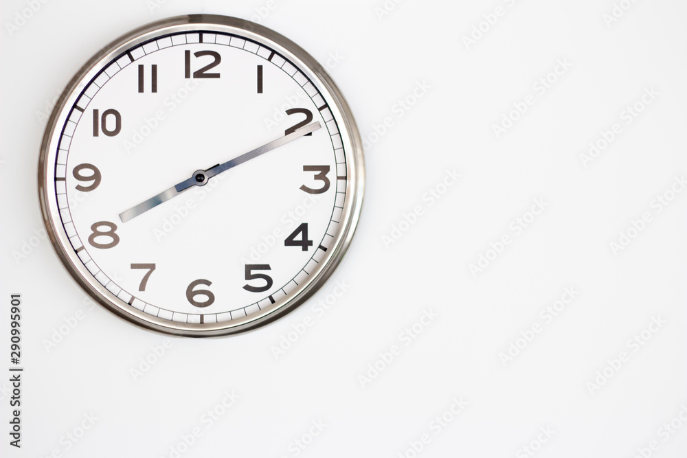 White Clock on White wall with copy-space. White Clock on White wall with copy-space.