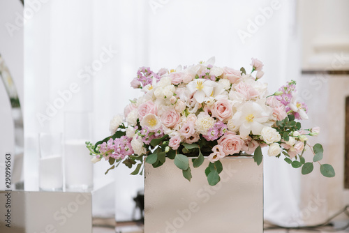 Many beautiful colors of light pastel shades on the table of the groom and bride. © Olga