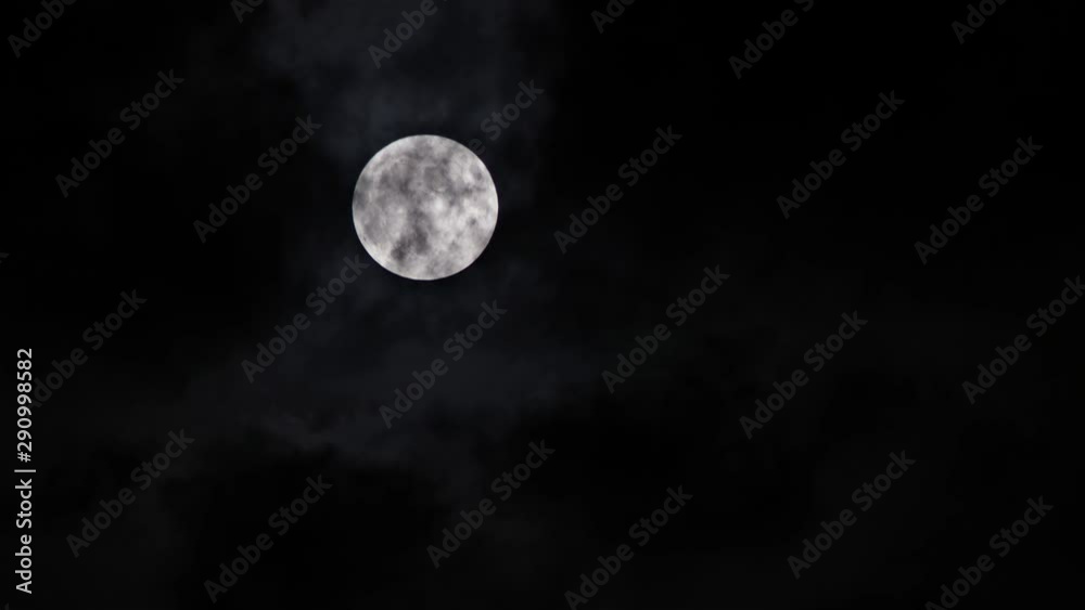 Full moon over dark sky with overcast mysterious night Full moon over dark sky with overcast mysterious night